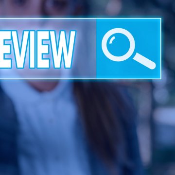 restoro system optimizer review review search bar magnifying glass man blurry in the background